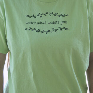 'WHAT WATERS YOU' TEE